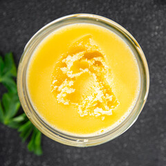Ghee butter or clarified butter delicious gourmet food background on the table rustic food top view copy space keto and paleo diet vegetarian and vegan food