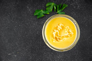 Ghee butter or clarified butter delicious gourmet food background on the table rustic food top view copy space keto and paleo diet vegetarian and vegan food