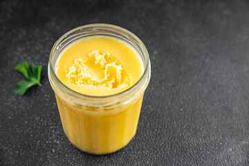 Ghee butter or clarified butter delicious gourmet food background on the table rustic food top view copy space keto and paleo diet vegetarian and vegan food