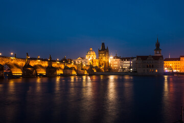 Obraz premium Prague old town city center skyline at night, capital of Czech Republic, River Vltava mirroring beautiful night city lights 