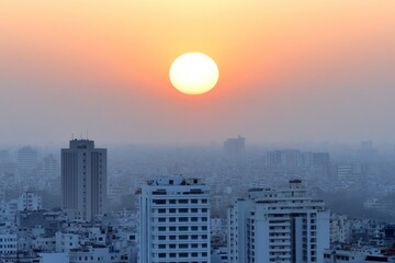 Fototapeta premium A hazy sunrise over a polluted city, with exhaust fumes from morning traffic rising into the sky