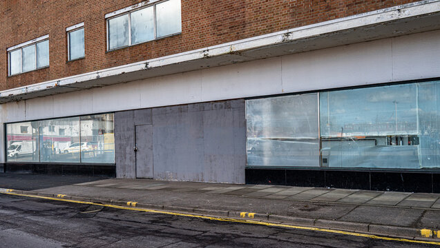 Closed and empty shops in a shopping centre depicting the dying UK high street.