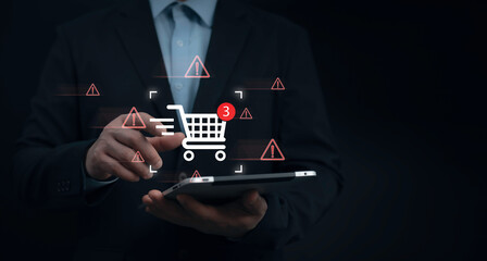 E-commerce security risk concept with a digital shopping cart and fraud warning alerts. Protecting online transactions against cyber threats and fraud detection © ACHJIMA