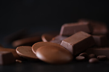 Artistic arrangement of chocolates in various shapes, perfect for advertisements or dessert-themed projects.