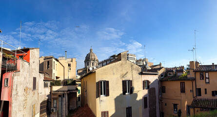 Facade of a historic tenement house in the center of the old town. Rome, Italy.