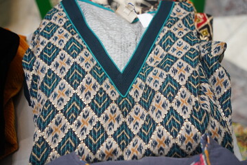 Clothes with a national Uzbek pattern. Craft fair.