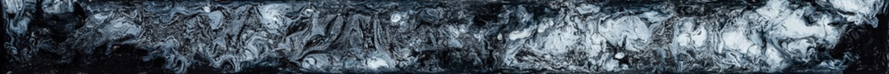 Beautiful black and white marble texture. Abstract background of flowing black and white paint with spots. Space background of acrylic paint with stars and beautiful nebulae. Large size photo.