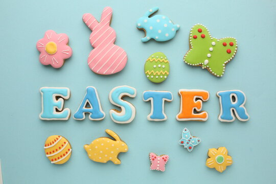  Easter biscuit moulds in pastel colours. Easter egg, bunny and chicken. Happy Easter day concept. Minimal concept. Space for text. Easter cookery on the background of baked goods.