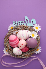 Easter nest with colorful eggs - Greeting card and spring background Happy Easter - Rustic season decoration