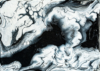 Beautiful black and white marble texture. Abstract background of flowing black and white paint with spots. Space background of acrylic paint with stars and beautiful nebulae. Large size photo.