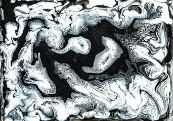 Beautiful black and white marble texture. Abstract background of flowing black and white paint with spots. Space background of acrylic paint with stars and beautiful nebulae. Large size photo.