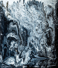 Beautiful black and white marble texture. Abstract background of flowing black and white paint with spots. Space background of acrylic paint with stars and beautiful nebulae. Large size photo.