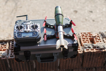 military drone with bomb replica ready to fly