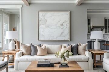Fototapeta premium Elegant living room with white sofa, gray walls, and marble artwork.