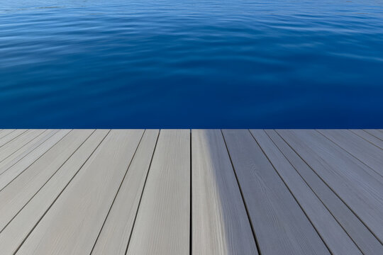 Tranquil waters meet wooden dock at sunrise in a serene lakeside location