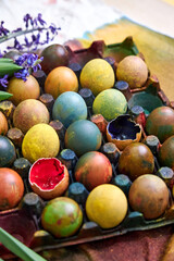 top view of a colored pallet with dyed Easter eggs with natural dyes