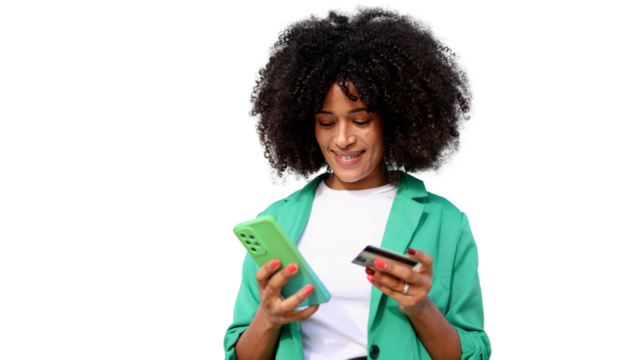 Smiling afro businesswoman making online payment using smartphone and credit card on transparent background - Powered by Adobe