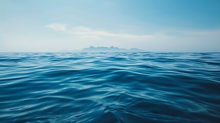 Obraz premium a calm ocean surface with water waves against clear blue sky