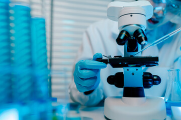 Scientist is using a microscope to examine a sample. Concept of curiosity and scientific exploration