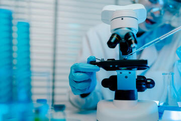 Scientist is using a microscope to examine a sample. Concept of curiosity and scientific exploration