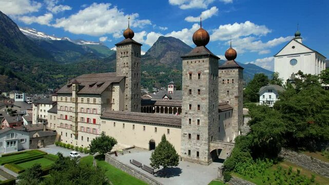Switzerland travel and landmarks. Valais canton, Brig town. Impressive Stockalper castle with beautiful garden and park
aerial high angle 4k hd video