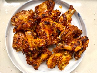 Air Fryer Chicken whole wings in plate ready to serve
