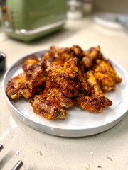 Air Fryer Chicken whole wings in plate ready to serve