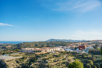 Obraz premium Beautiful view of Polop, Spain with a rocky mountain on the background