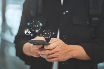 Digital AI chatbot, Happy young tourist man using mobile smartphone with AI chatbot for online information in city town, conversation assistant, technology