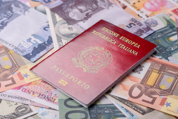 International passport of a citizen of Italy on background of paper banknotes