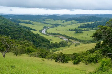 Obraz premium Serene Panoramic Valley Landscape with Meandering River