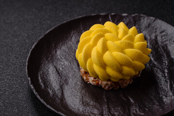 Round sweet tart of yellow color with citrus and passion fruit flavor