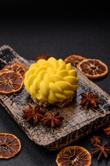 Round sweet tart of yellow color with citrus and passion fruit flavor