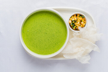 green cream soup on the white