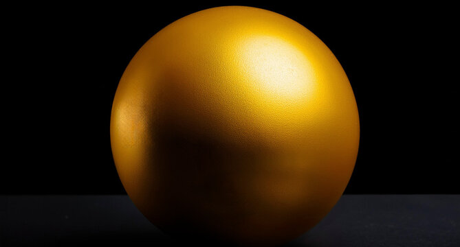 Abstract realistic minimal background, glossy golden or yellow sphere in black backdrop. contrast for design objects and empty space. Closeup minimalistic amber tones.