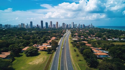 Fototapeta premium A highway cutting through a metropolis, with high-rise buildings framing both sides.