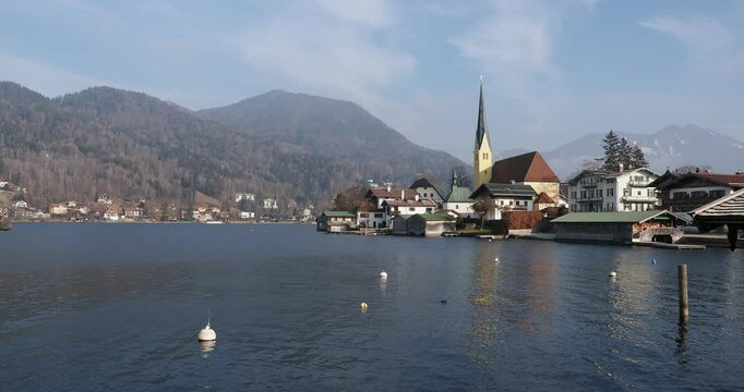 Picturesque village of Rottach-Egern and its bell tower on the southern shore of Lake Tegernsee surronded by Bavarian foothills