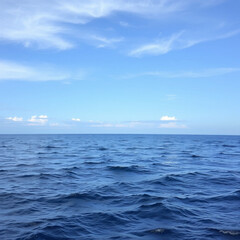 Ocean view with bright blue sky feels like dream, with calm waves shimmering under sunlight. Pure, peaceful, and inspiring