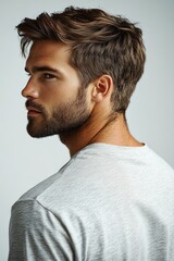 Fototapeta premium A person with a beard dressed in a white shirt, suitable for various uses such as portraits, illustrations or storytelling