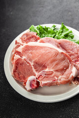 Pork on bones raw meat fresh tasty food dish delicious gourmet food background on the table rustic food top view copy space