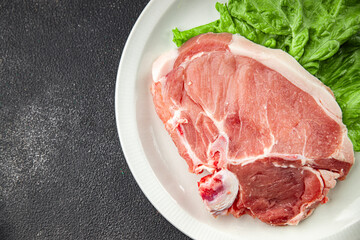 Pork on bones raw meat fresh tasty food dish delicious gourmet food background on the table rustic food top view copy space