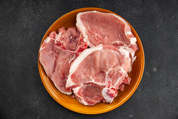 Pork on bones raw meat fresh tasty food dish delicious gourmet food background on the table rustic food top view copy space