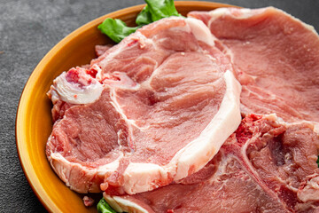 Pork on bones raw meat fresh tasty food dish delicious gourmet food background on the table rustic food top view copy space