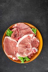 Pork on bones raw meat fresh tasty food dish delicious gourmet food background on the table rustic food top view copy space