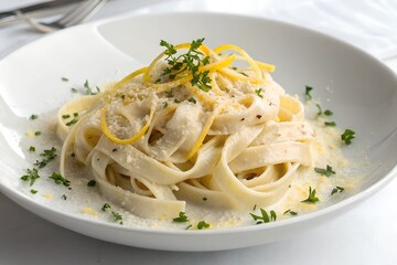 Creamy fettuccine alfredo with parmesan and lemon zest. Delicious fettuccine alfredo served in a creamy parmesan sauce, garnished with fresh parsley and lemon zest for a refreshing touch