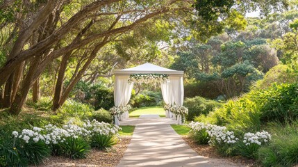 Fototapeta premium Decorated Wedding Canopy with White Flowers in Beautiful Garden Setting