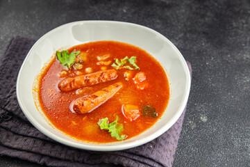 Tomato soup with sausages fresh tasty food dish delicious gourmet food background on the table rustic food top view copy space