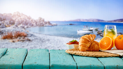 Continental breakfast against the backdrop of a tropical beach and calm sea