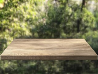 Fototapeta premium Empty wooden table against blurred green nature background.