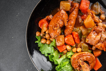 Ragout meat, sausages, vegetables stew dish fresh tasty food delicious gourmet food background on the table rustic food top view copy space